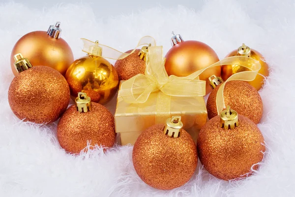 Christmas brightly spheres on the white fur — Stock Photo, Image