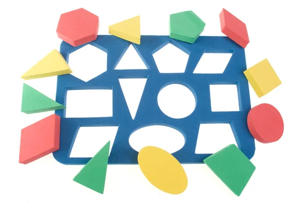 Barns lek med färg geometriska former — Stockfoto