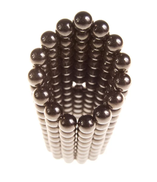 Abstraktní postava malých kovových kuliček — Stock fotografie