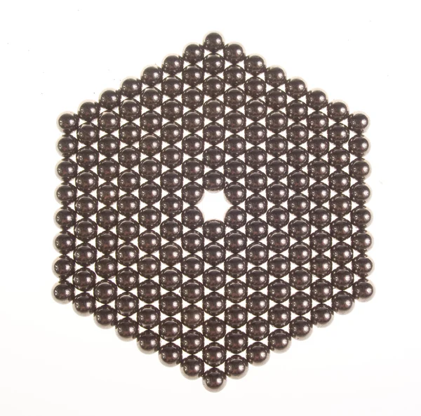 stock image Hexagon of small metal balls on the white background