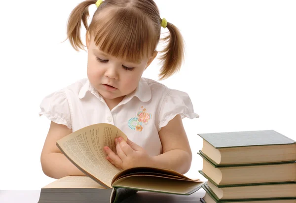 Cute little girl is reading book, back to school — Stock Photo, Image