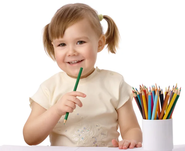 Cute child draws with color pencils — Stock Photo, Image