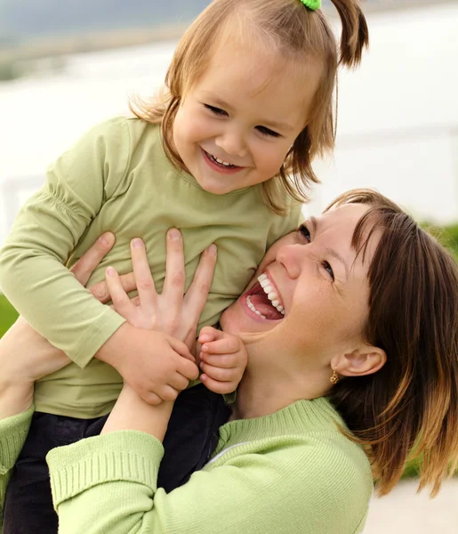 Mother and daughter having fun outdoor — Stock Photo, Image