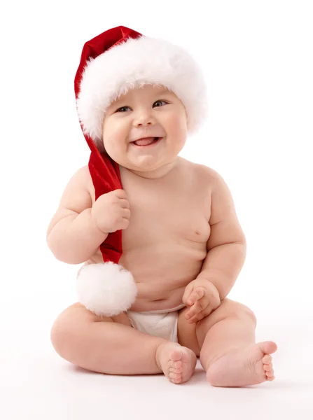 Lilla barnet bär röd jul mössa — Stockfoto