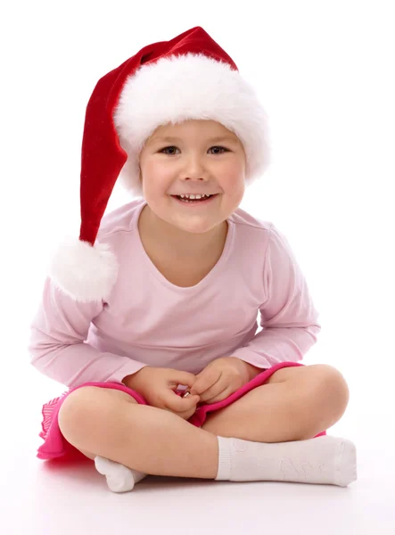 빨간 크리스마스 모자를 쓰고 어린 소녀 — 스톡 사진