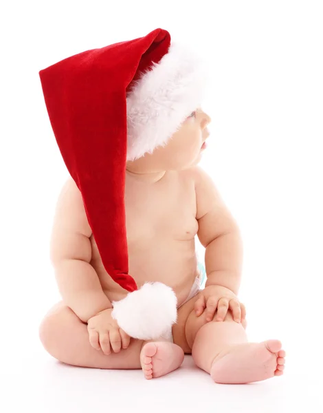 Malé dítě nosit červené vánoční čepice — Stock fotografie