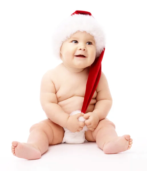 Piros karácsonyi sapkát visel kisgyermek — Stock Fotó