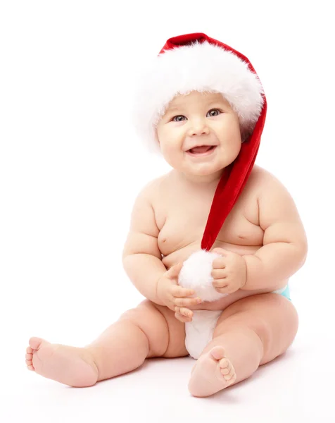 Μικρό παιδί φορώντας κόκκινο καπάκι Χριστούγεννα — Φωτογραφία Αρχείου
