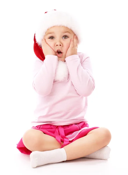 Piros karácsonyi sapkát visel kislány — Stock Fotó