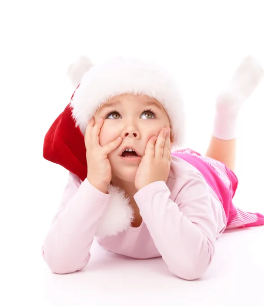 Little girl wearing red Christmas cap — Stok fotoğraf