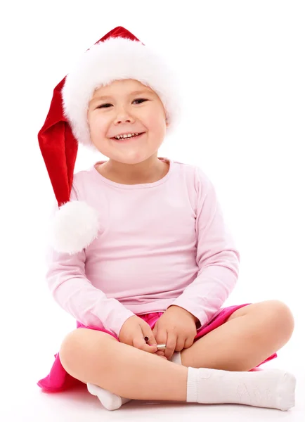 Piros karácsonyi sapkát visel kislány — Stock Fotó