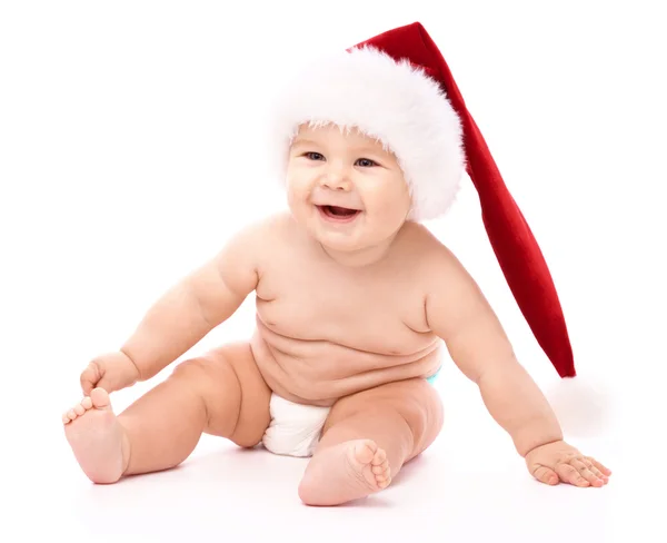 Μικρό παιδί φορώντας κόκκινο καπάκι Χριστούγεννα — Φωτογραφία Αρχείου