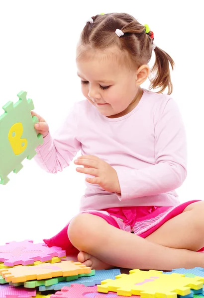 Little girl with alphabet Stock Image