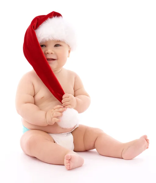 빨간 크리스마스 모자를 쓰고 어린 아이 — 스톡 사진