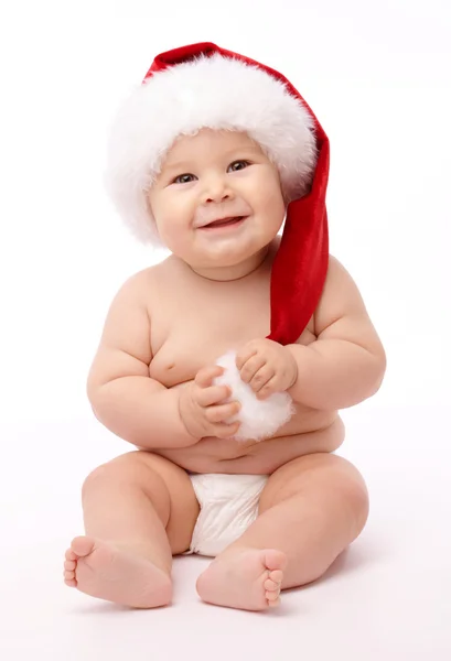 Little child wearing red Christmas cap — Stock Photo, Image