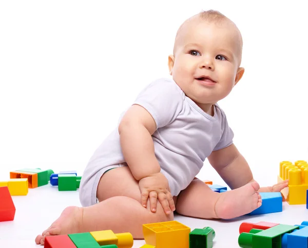 Cute Little Boy Playing Building Bricks While Sitting Floor Isolated Stock Image