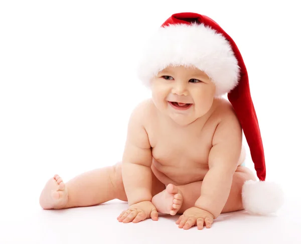 Little child wearing red Christmas cap — Stockfoto