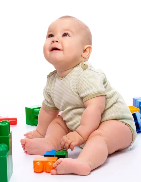 Cute Little Boy Playing Building Bricks While Sitting Floor Isolated Stock Photo