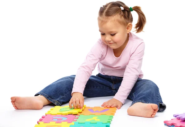 Cute Little Girl Playing Alphabet Putting Hands While Sitting Floor — Stock Photo, Image
