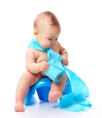 Child on potty play with blue toilet paper, isolated over white clipart