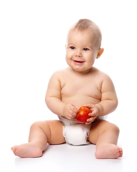 Маленький ребенок с яблоком — стоковое фото