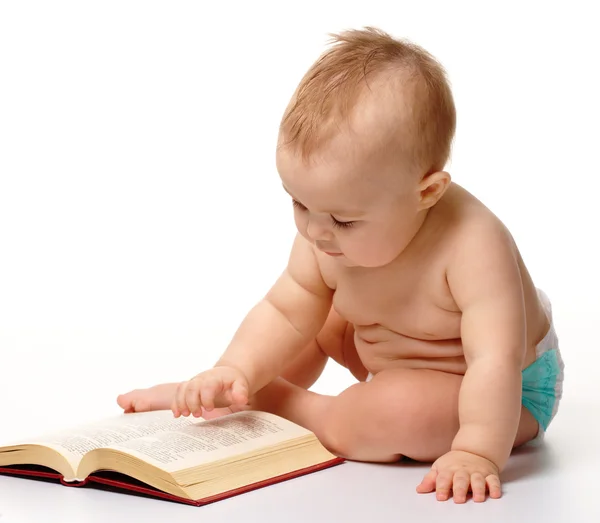 Little child play with book Stock Photo