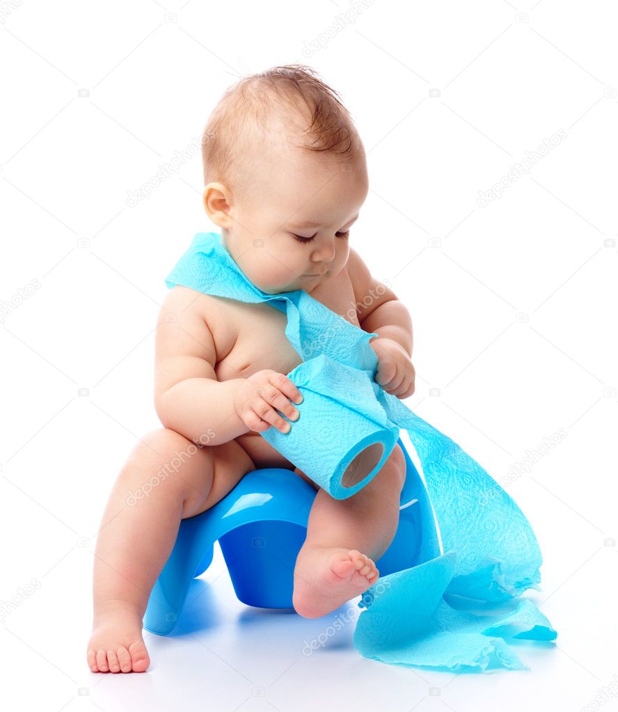 Child on potty play with blue toilet paper, isolated over white