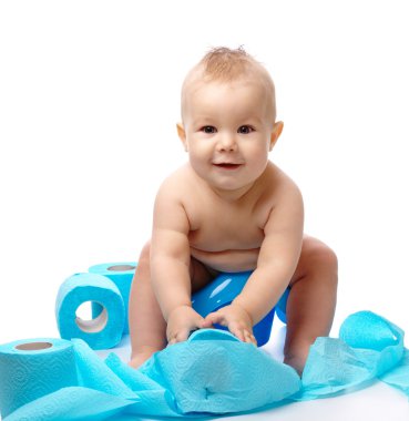 Child on potty play with blue toilet paper, isolated over white clipart