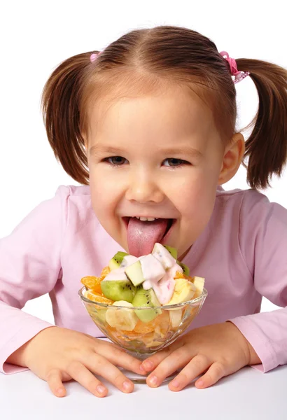 Cute Little Girl Licks Fruit Salad Isolated White — Stock Photo, Image