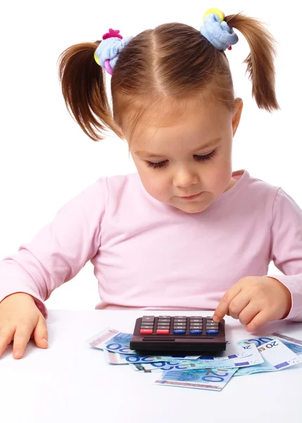 Милая Маленькая Девочка Играет Деньгами Изолированные Над Белым — стоковое фото