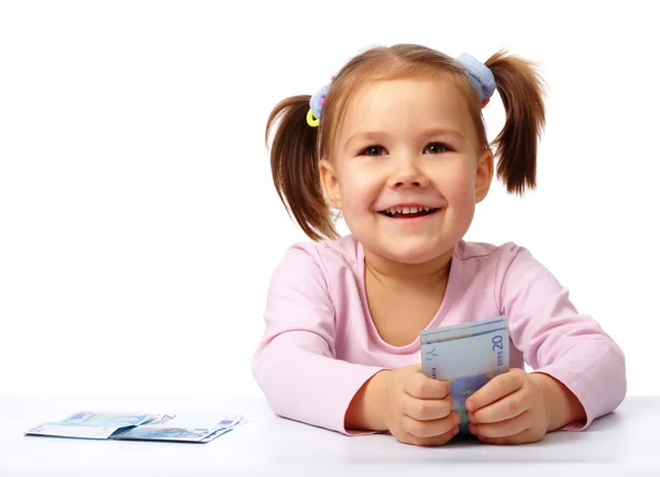 Szczęśliwa Dziewczynka Kilku Dwadzieścia Banknotów Białym Tle Nad Białym — Zdjęcie stockowe