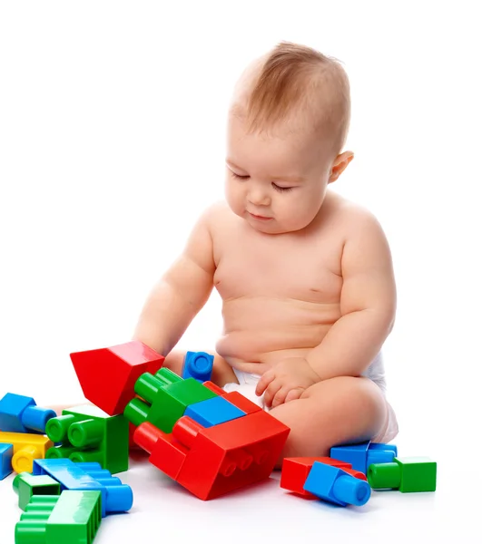 Cute Little Boy Playing Building Bricks While Sitting Floor Isolated Royalty Free Stock Photos