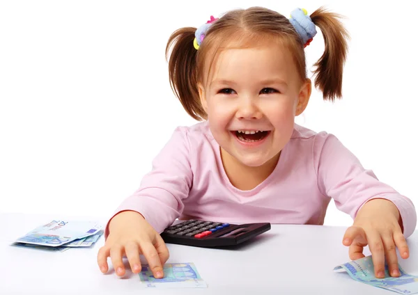Little girl with few paper euro banknotes Royalty Free Stock Images
