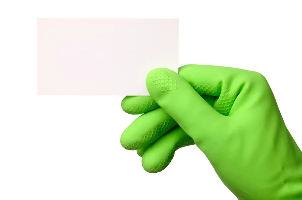 Hand in grünem Handschuh zeigt Visitenkarte — Stockfoto