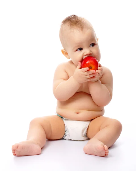 Küçük çocuk kırmızı elma ısıracak — Stok fotoğraf