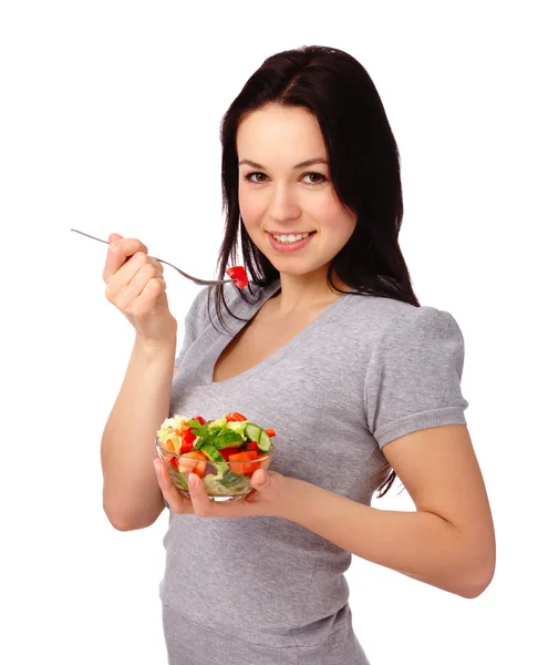 Giovane donna attraente mangia insalata di verdure — Foto Stock