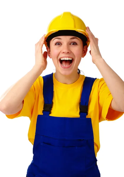 Construction girl holds her hard hat and scream — Stock Photo, Image