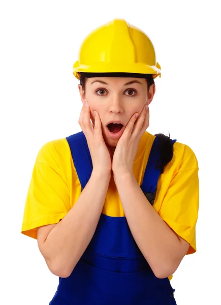Construction girl holding her face in astonishment — Stock Photo, Image