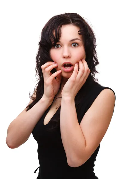 Young woman holding her face in astonishment — Stock Photo, Image