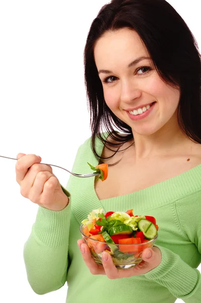 Νέα ελκυστική γυναίκα τρώει σαλάτα λαχανικών — Stock fotografie