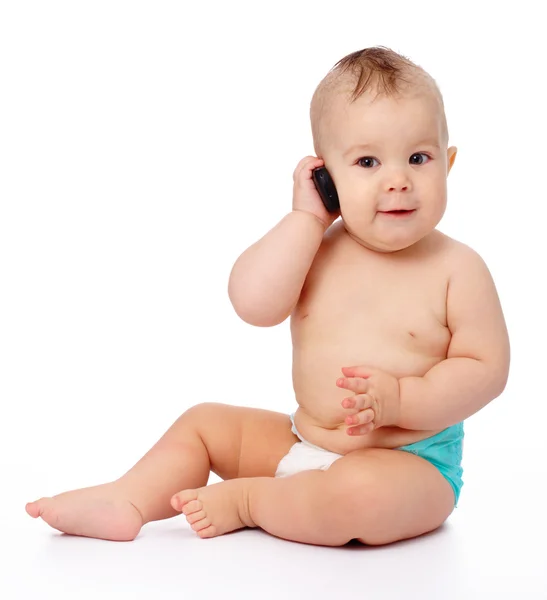 Schattige kleine baby is praten op mobiele telefoon — Stockfoto