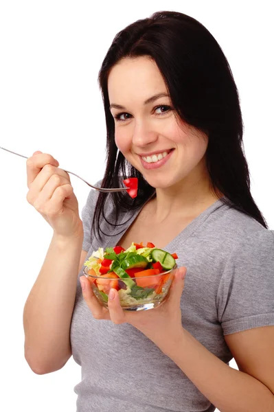 Jonge aantrekkelijke vrouw eet fruit salade — Stockfoto