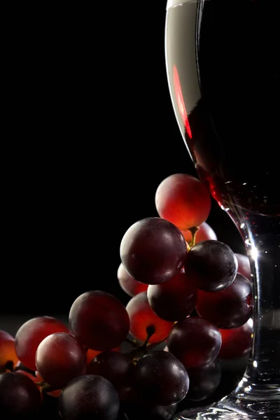 stock image Red wine with grapes