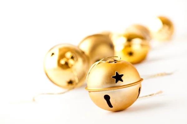 Golden Christmas baubles on white — Stock Photo, Image