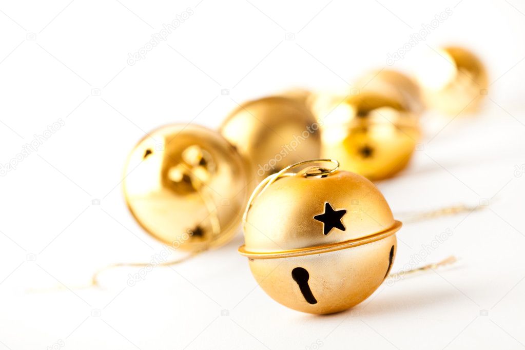 Golden Christmas baubles on white
