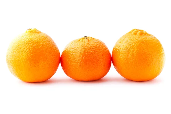 Три мандарина — стоковое фото