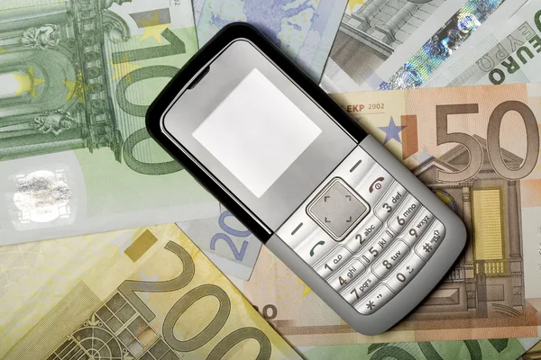 Celular Telefone celular e dinheiro — Fotografia de Stock
