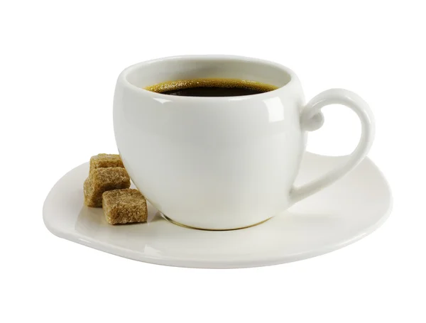 En kopp kaffe med bitar av socker Stockbild