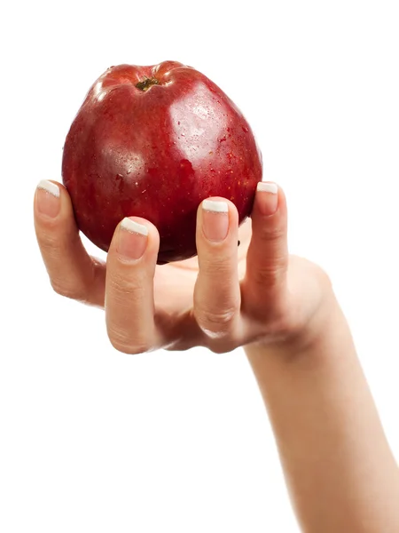 W kobiet strony czerwone jabłko — Zdjęcie stockowe