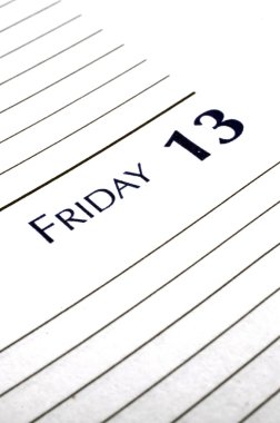 Personal planner opened to Friday the 13th. clipart